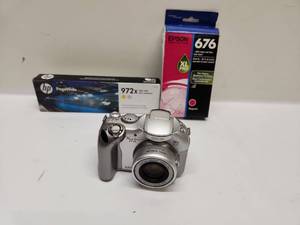 lot 39 image: Canon PowerShot S1 IS 3.2MP Digital Camera with Printer Ink Cartridges