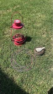 lot 205 image: Red Metal Lantern with Glass Chimney and Decorative Hanger Ring