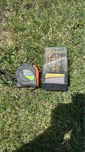 lot 213 image: Lot 30 ft Tape Measure and 22 pc Titanium Coated Drill Bit Set