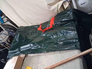 lot 27 image: KYSY Tarp Green with Red Handles Approximately 60 x 80 inches