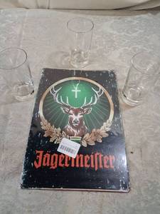 lot 46 image: J�germeister Metal Sign and 4 Shot Glasses Set