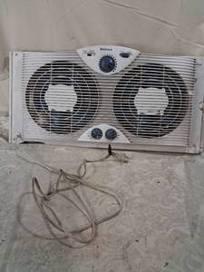 lot 71 image: Holmes Dual Twin Window Fan with Thermostat Control