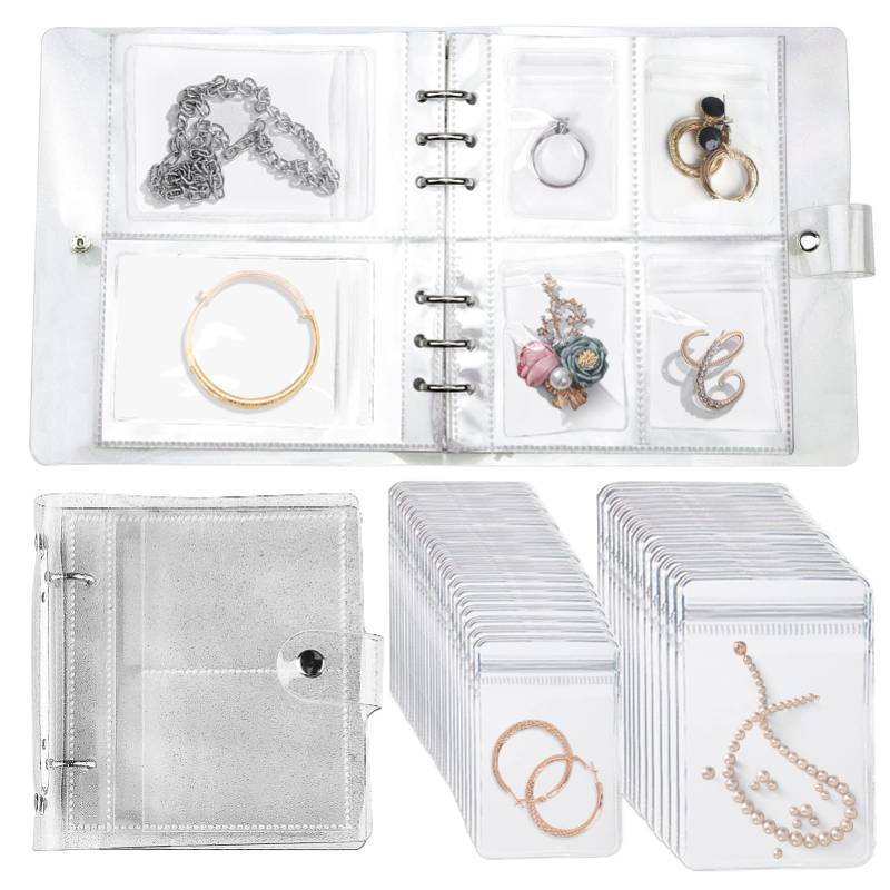 lot 2057 image: Transparent Jewelry Storage Book with Anti-Oxidation Pockets, Jewlwey Organizer Album New Generation, Various Sized Grid, Detachable, for Earrings, Necklace, Stud, Bracelets, and Rings for Travel - Retail $15