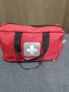 lot 2596 image: First Aid Kit Red Canvas Bag with Bandages Gauze and Medical Supplies