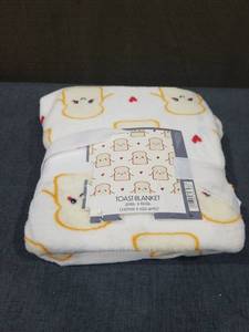 lot 2728 image: Toast Blanket 50in. x 60in. (127cm x 152.4cm)