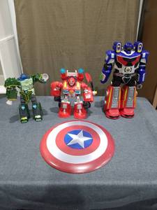 lot 2871 image: Action Figures and Shield Disc Lot - Transformers-Style Robots and Superhero Accessory
