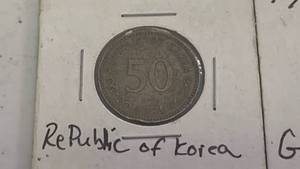 lot 44 image: Lot of 3 foreign Coins - 50 Won Korea, 10 Pfennig German, and 5 Centavos Guatemala