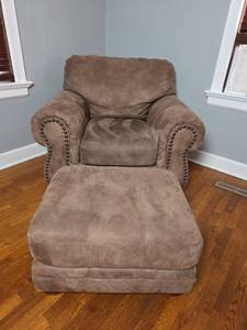 lot 101 image: Brown Upholstered Armchair with Ottoman and Nail Head Trim- Matches lot 100