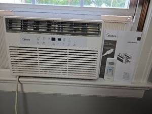 lot 104 image: Midea MAW08S1WWT-T Window Air Conditioner 8000 BTU 115V- Buyer needs to remove from window.