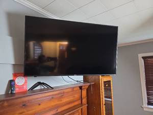 lot 107 image: Onn ROKU TV 50in - Model # 100012585 with Remote and Legs- Wall mount is NOT included