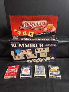 lot 186 image: Scrabble Board Game, Rummikub Game, and 4 Playing Card Decks Lot