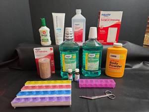 lot 219 image: First Aid & Personal Care Lot Bandages, Mouthwash, Body Powder, Alcohol, Surgical Dressing, Pill Organizers, Scissors