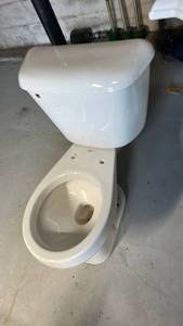 lot 7014 image: Never used Two-Piece Toilet with Rounded Tank and Bowl