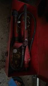 lot 7050 image: Hydraulic Hand Pump with Hose and Red Metal Case