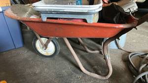 lot 7057 image: Wheelbarrow with Mixed Tool Lot �� Saw Blades, Bose Speaker, Drill, Assorted Items