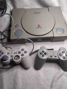 lot 2001 image: Sony PlayStation 1 Console with 3 Controllers and Memory Cards