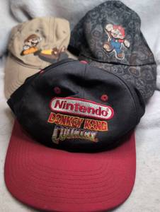 lot 2100 image: Nintendo Donkey Kong  Mario Hats - 3 ct