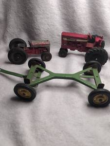 lot 2203 image: International Harvester 656 Farm Tractor Toy and Green Trailer - 3 ct