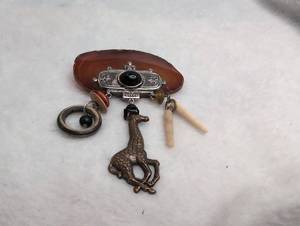 lot 4001 image: Decorative Brooch Metal Charms and Black Stone