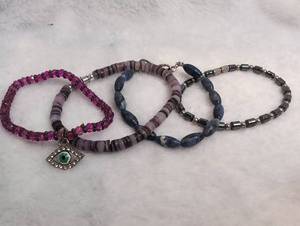 lot 4006 image: 4 Beaded Bracelets One w with Evil Eye Charm