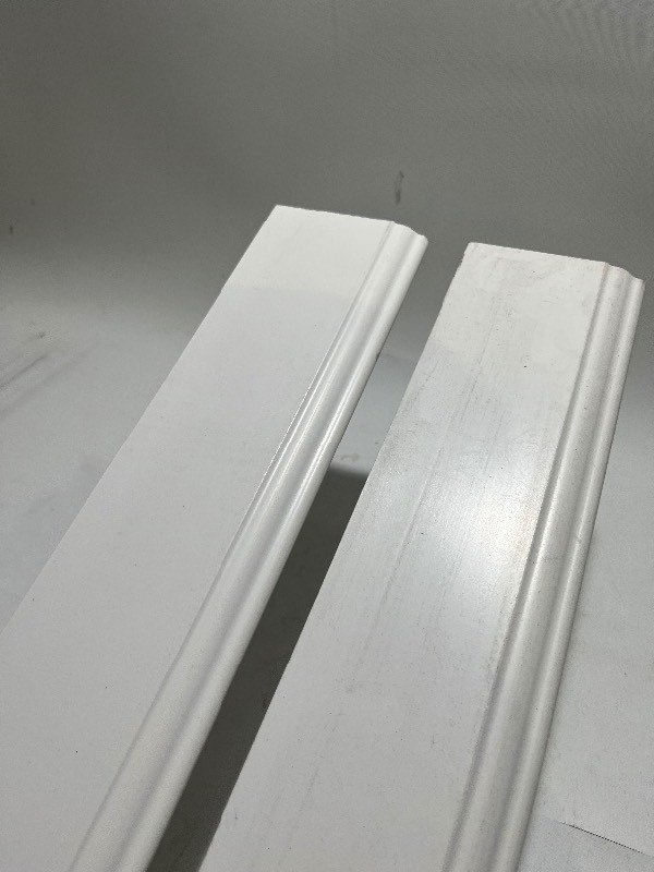 lot 115 image: 2 Pieces 716 in. x 3 14 in. x 96 in. Colonial Finished PVC White Baseboard Molding 5523