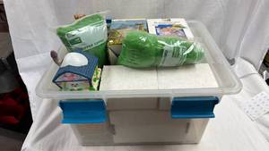 lot 77 image: Sterilite 32 Qt Plastic Storage Bin Full of Easter Decorations