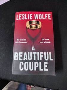 lot 10350 image: A Beautiful Couple by Leslie Wolfe Paperback Book