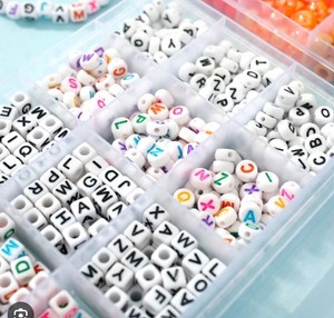 lot 2203 image: Beads with letters on it