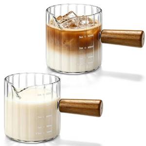 lot 10380 image: 2 Pack Espresso Measuring Cups, 4oz Borosilicate Glass Espresso Shot Glasses with Wood Handle, V-Shaped Spout Ribbed Milk Frothing Cup, Measuring Cup for Coffee, Latte, Cappuccino, Tea, Syrup