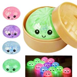 lot 6457 image: 2026 New Glitter Will Emit Light Dumplings Squishy,Colorful Dumplings Stress Balls Fidget Sensory Box,Stress Relief Stretchy Desk Toys (Green)