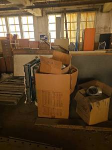 lot 14056 image: Contents of Bay Including Heavy Duty Doors, Vise, and Retail Shelving