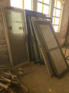 lot 14064 image: Bulk Lot of Glass Storefront Doors and Metal Doors