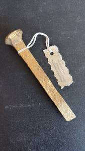 lot 2064 image: Gold-Painted Railroad Spike with Tag Anchor of the Plains
