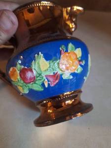 lot 3036 image: 1840s pottery copper lustreware small wine jug with Bacchus mask and floral sprays