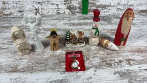 lot 110 image: Christmas Figurine Collection with Angel, Village House, and Wood Carvings