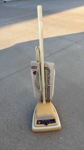 lot 150 image: Eureka ESP Triple Filter Upright Vacuum Cleaner -powers on
