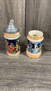 lot 340 image: Two German Ceramic Beer Steins with Lids and Decorative Details