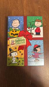 lot 16 image: Peanuts Deluxe Holiday Collection DVD Box Set