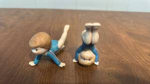 lot 69 image: Pair of Ceramic Acrobatic Figurines Blue and Cream 2 Count