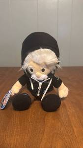 lot 76 image: Salesforce Trailblazer Plush Doll with White Hair and Black Jacket