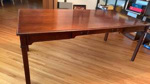 lot 905 image: Alma Furniture Company Desk with Drawers and Blue Cross Blue Shield Property Label 28X71X35