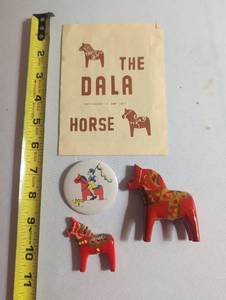 lot 1032 image: The Dala Horse Book with Red Decorative Horse Figurines and Button