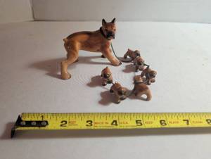 lot 1033 image: Miniature Dog Figurine Set with Mother and 6 Puppies on Chain Leash