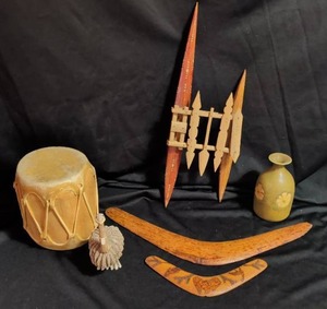 Carved Wood Boomerangs, boat, leather drum, Japanese sake decanter, and more