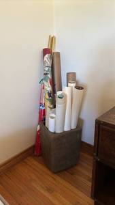 lot 1109 image: Assortment of rolled prints, Etc., in a cement planter