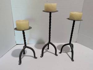 lot 1210 image: 3 Metal Candlestick Holders with Twisted Stems and Candles