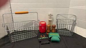 lot 1304 image: Twenty  Metal Wire Baskets with Handles, salt and pepper shakers and coozies.