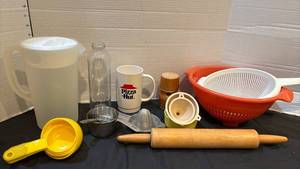 lot 1327 image: Kitchen Gadget Lot Pitcher Mug Colander Rolling Pin Measuring Cups Juicer