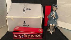 lot 1426 image: Lladr� Figurine Graduate Girl with Red Box and Decorative Tin