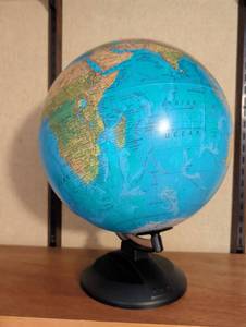 lot 1506 image: Tabletop World Globe with Black Base Stand